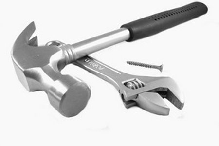 Photo of a hammer and spanner - trade tools