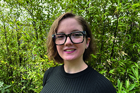 Erika Fenocchi smiling with trees in the background of the shot