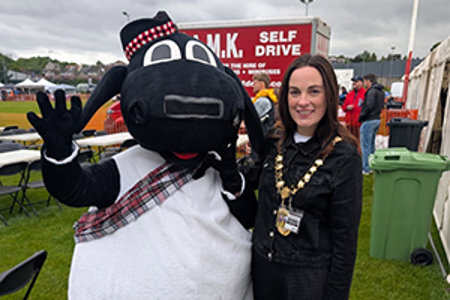 Depute Provost McDiarmid with the Highland Games mascot