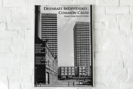 Black and white photograph from the exhibition showing tower blocks and other housing together with wording: Disparate Individuals: Common Cause. Street Level Photoworks. Lillie Art Gallery, Station Road, Milngavie G62 8BZ, 0141956 5536. Opening Times Tuesday – Saturday, 10am – 1pm and 2-5pm. Closed Sunday and Monday. 24th August – 26th September 2024.