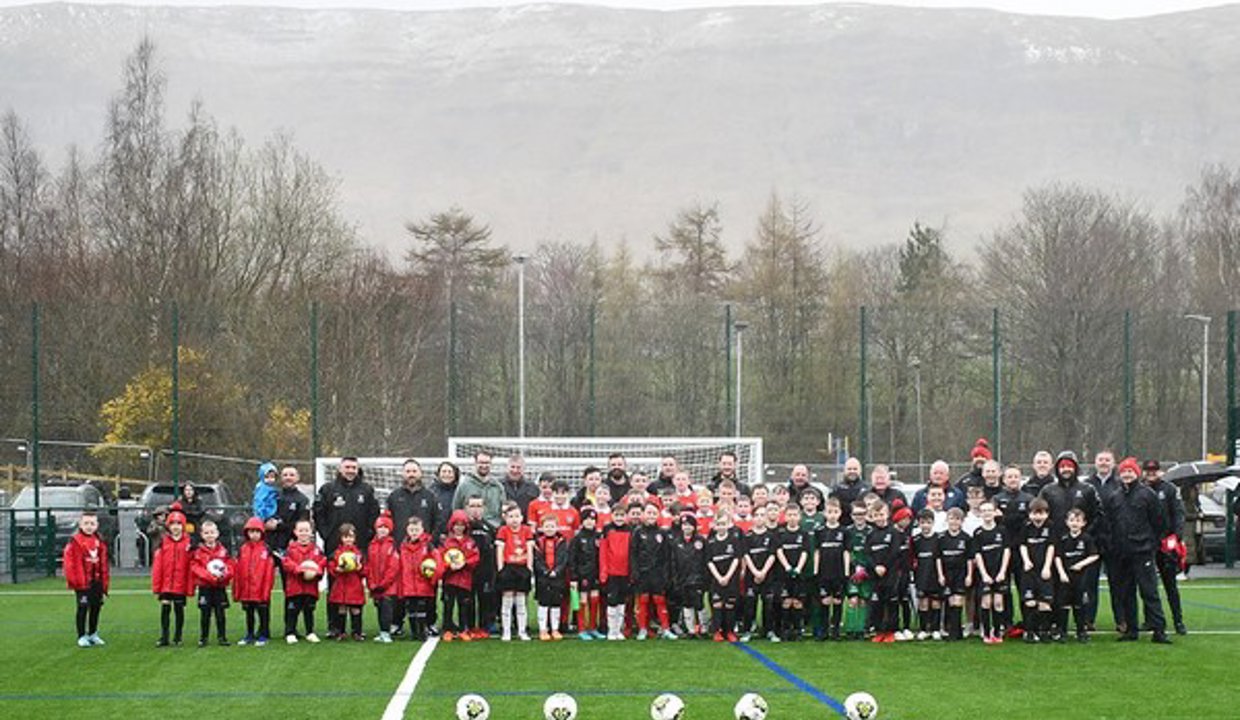 Kids and coaches on the football pitch at the new Lennoxtown Sports Facility
