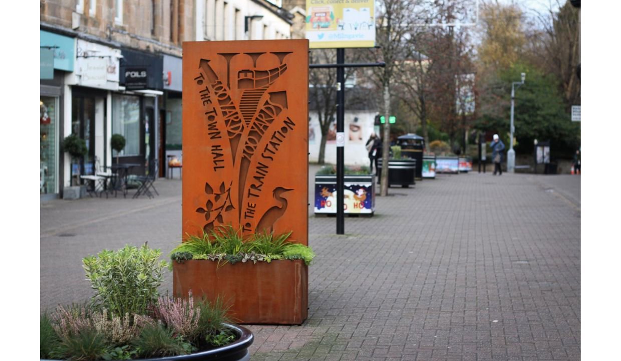 brown sign in the milngavie town centre