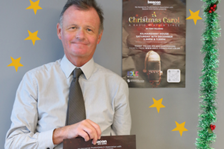 jim gibbons hold a christmas poster