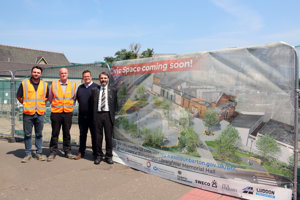 Pictured standing next to a banner at the new Civic Space are Stephen McLaren, Site Engineer – Luddon Construction; Scott Russell, Project Manager – Luddon Construction; Michael Rice, a City Deal Team Leader at East Dunbartonshire Council; Councillor Gordan Low, Leader of the Council.
