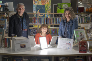Professor Hayden Lorimer of the University of Edinburgh, Wintering Well box user Claire Charlwood, and Professor Hester Parr of the University of Glasgow are pictured in Kirkintilloch’s William Patrick Library.