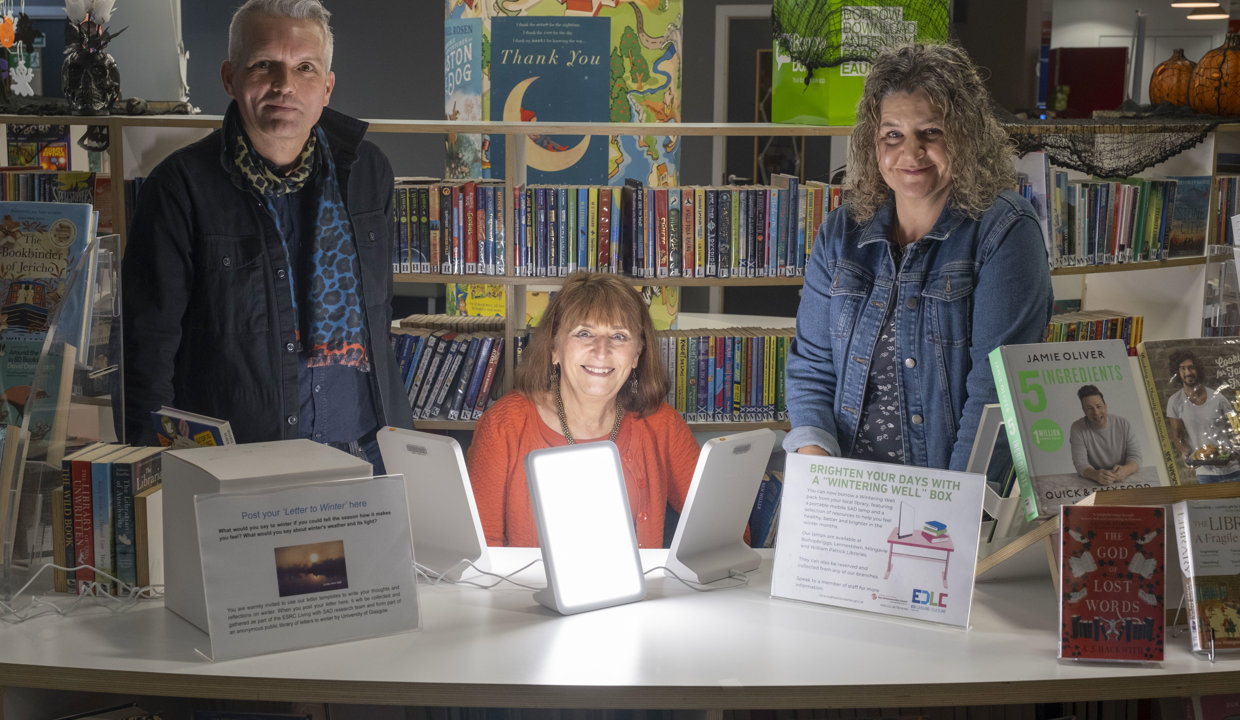 Professor Hayden Lorimer of the University of Edinburgh, Wintering Well box user Claire Charlwood, and Professor Hester Parr of the University of Glasgow are pictured in Kirkintilloch’s William Patrick Library.