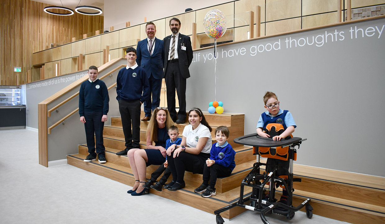 Councillor Gordan Low with Woodland View pupils and head teacher inside the new school building on opening day