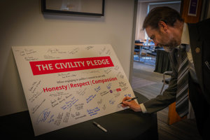 Council Leader Gordan Low has signing the pledge 