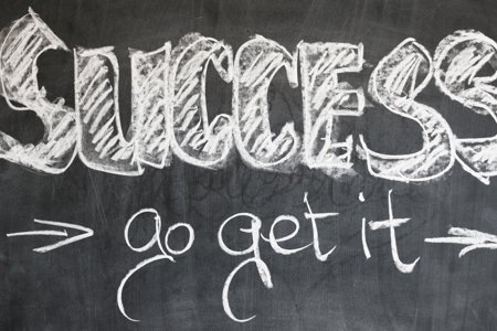 success go get it wrote on a blackboard