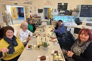 people are pictured enjoying a cuppa and a blether at one of the monthly groups.