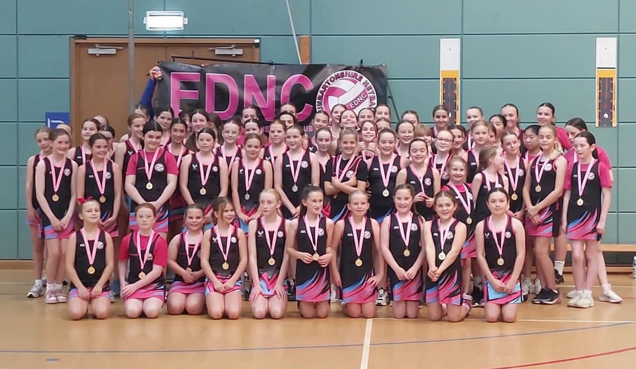 Members of East Dunbartonshire Netball Club celebrate their 10th anniversary with a large team picture