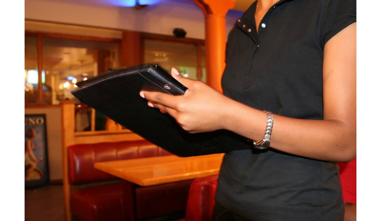 bartender taking order on a tablet device