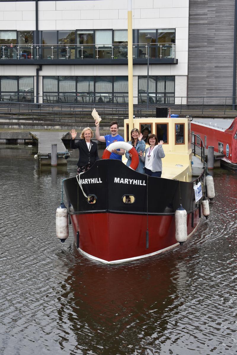 image of actors and councillor on boat leaving marina