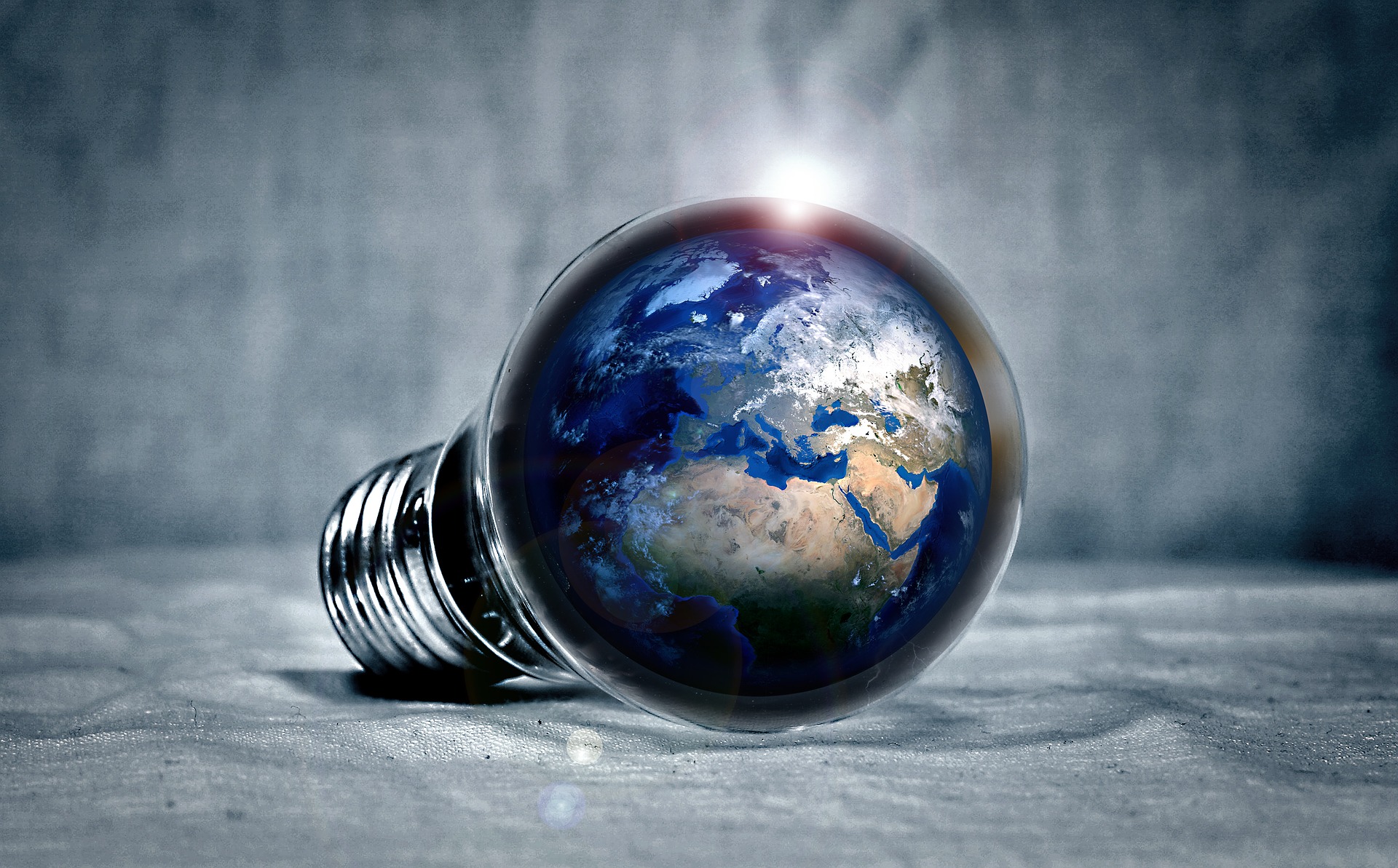 Image of light bulb containing the world