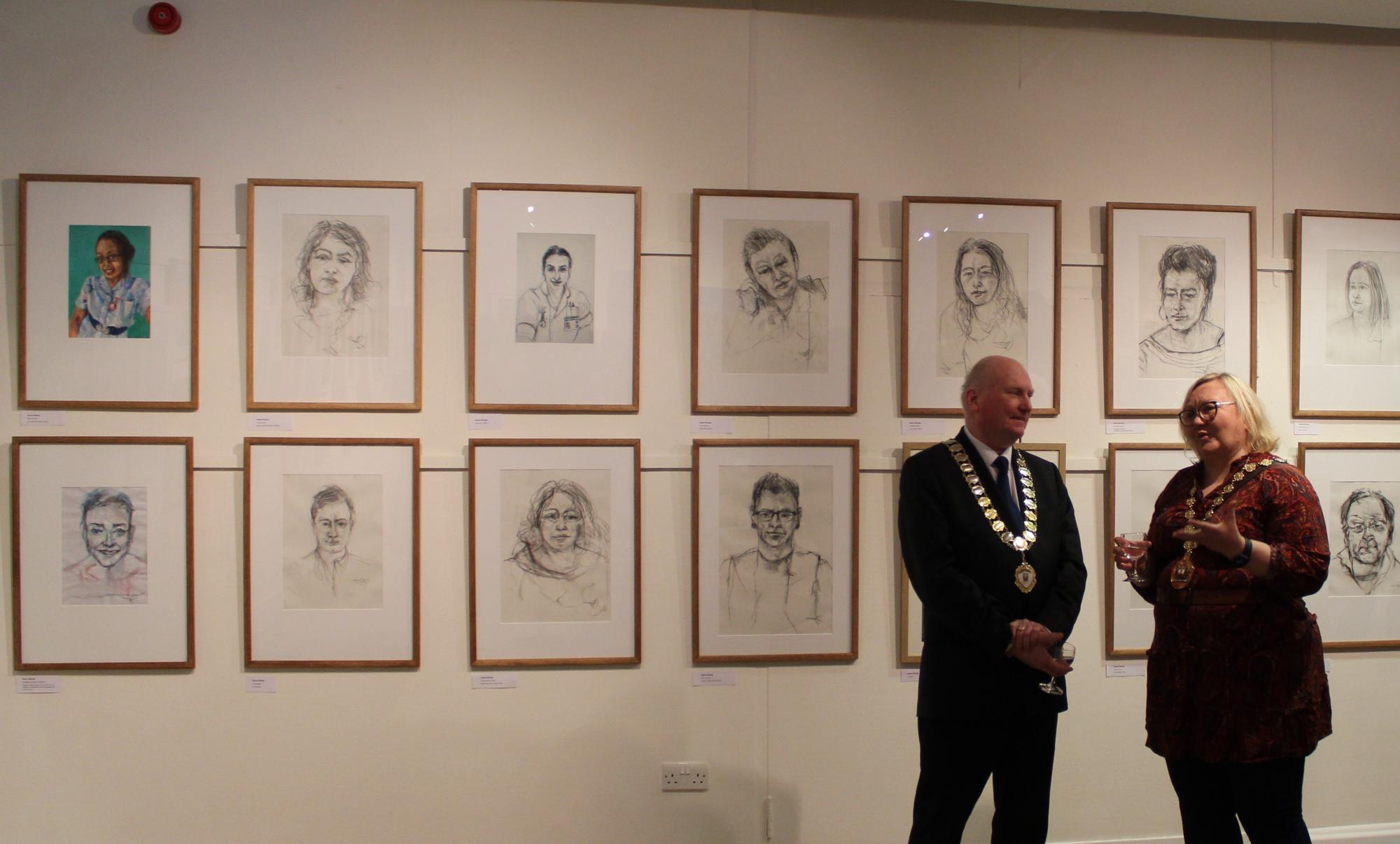 East Dunbartonshire Provost Gillian Renwick and Clackmannanshire Provost Donald Balsillie are pictured in front of paintings at the exhibition