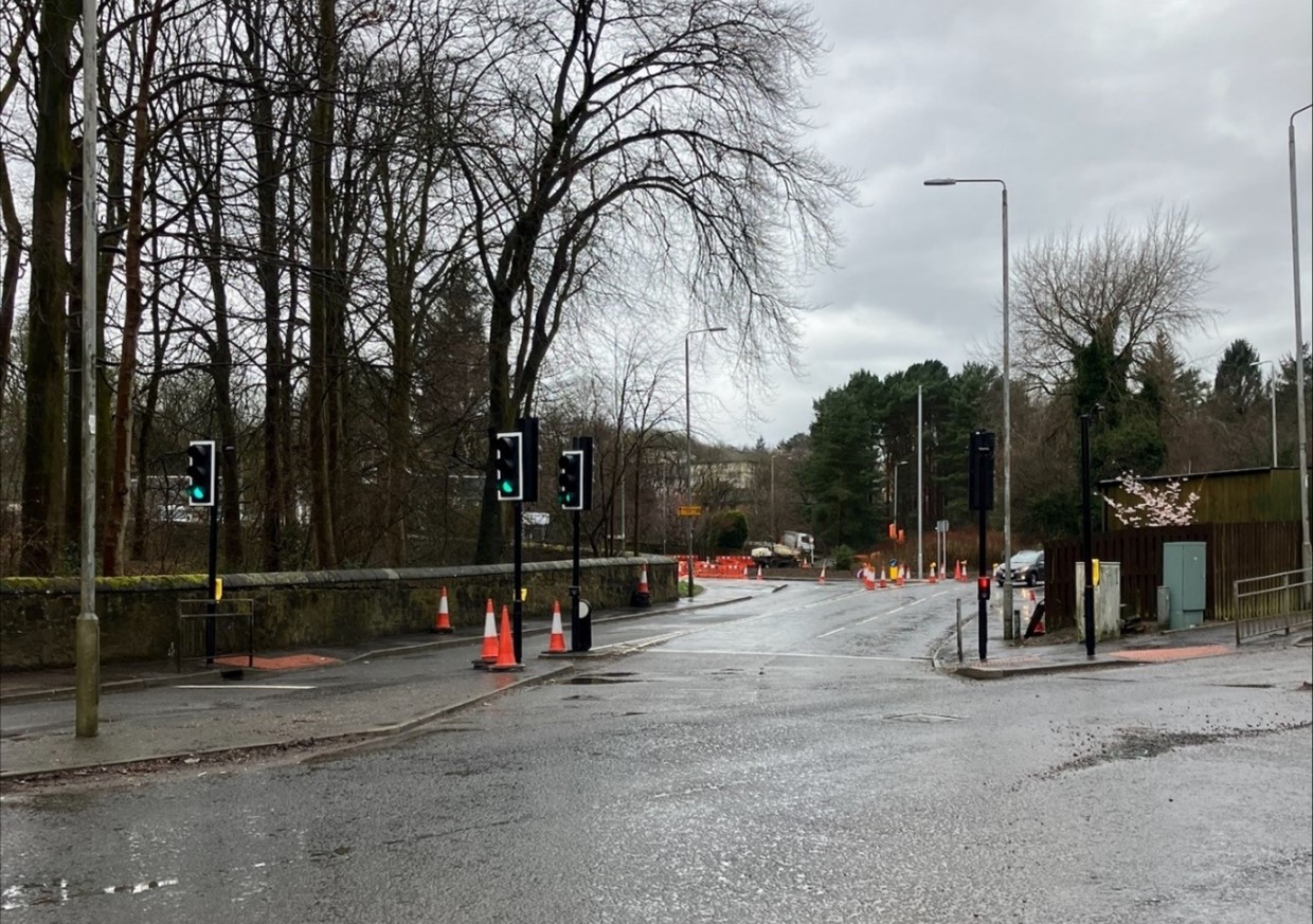 Maryhill Road Junction Complete showing open road with traffic lights, traffic cones, street lights and trees at the side