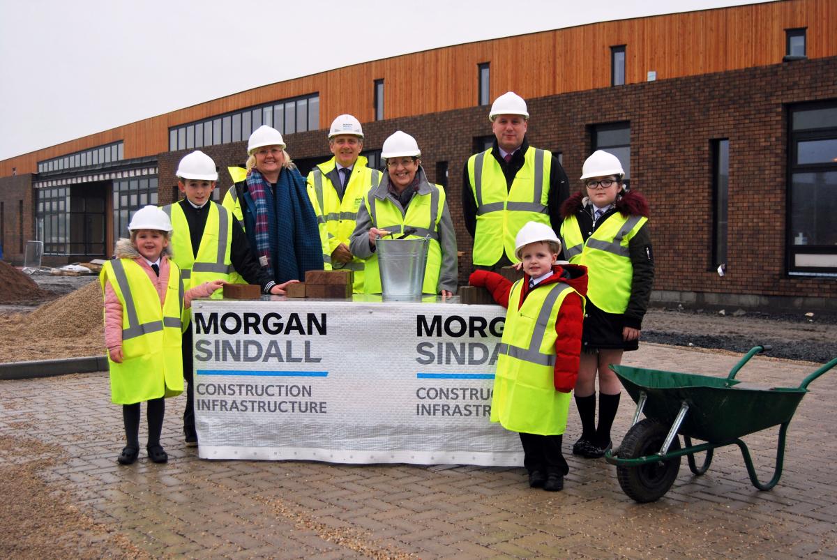 Image of Councillors and children at school new build