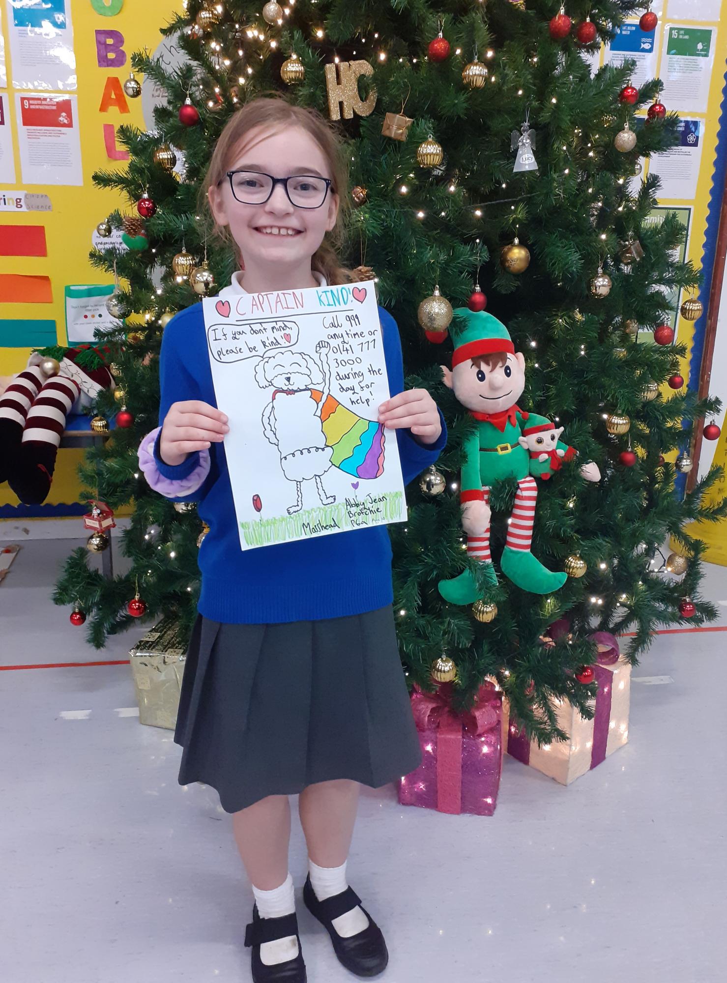 Abby holding her superhero drawing