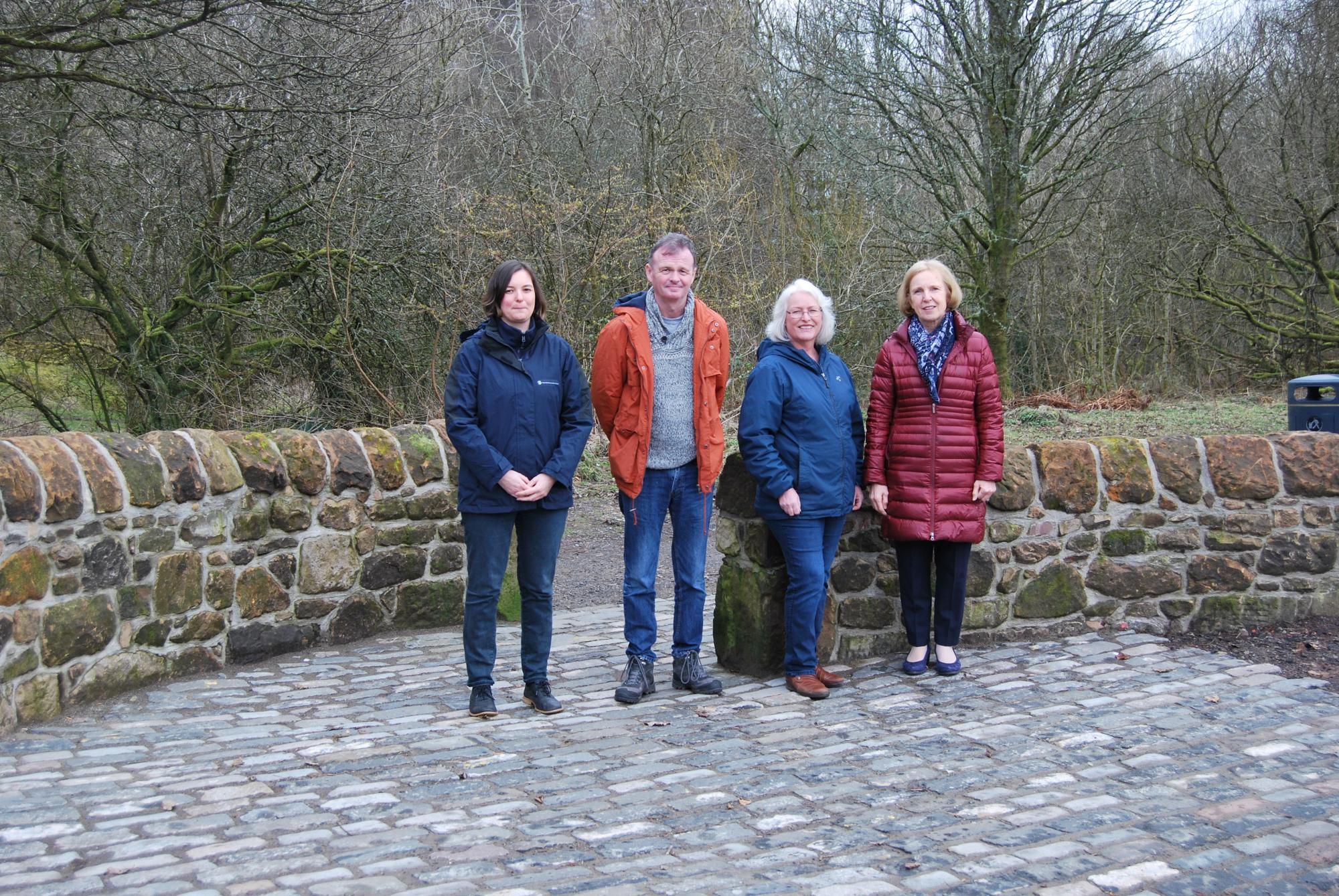 Councillors and employees at stone wall