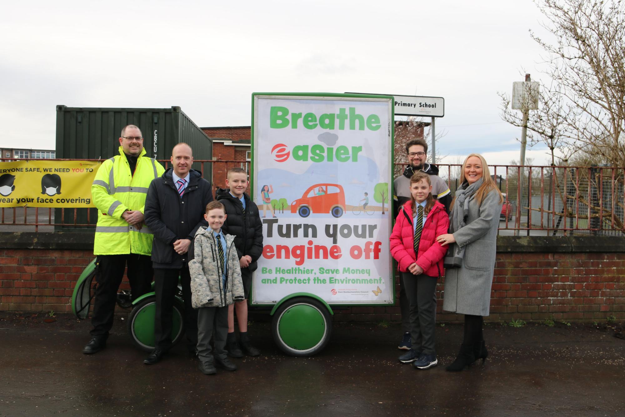 Councillor Paul Ferretti with St Matthew's Primary pupils, standing next to the Breathe Easier adbike