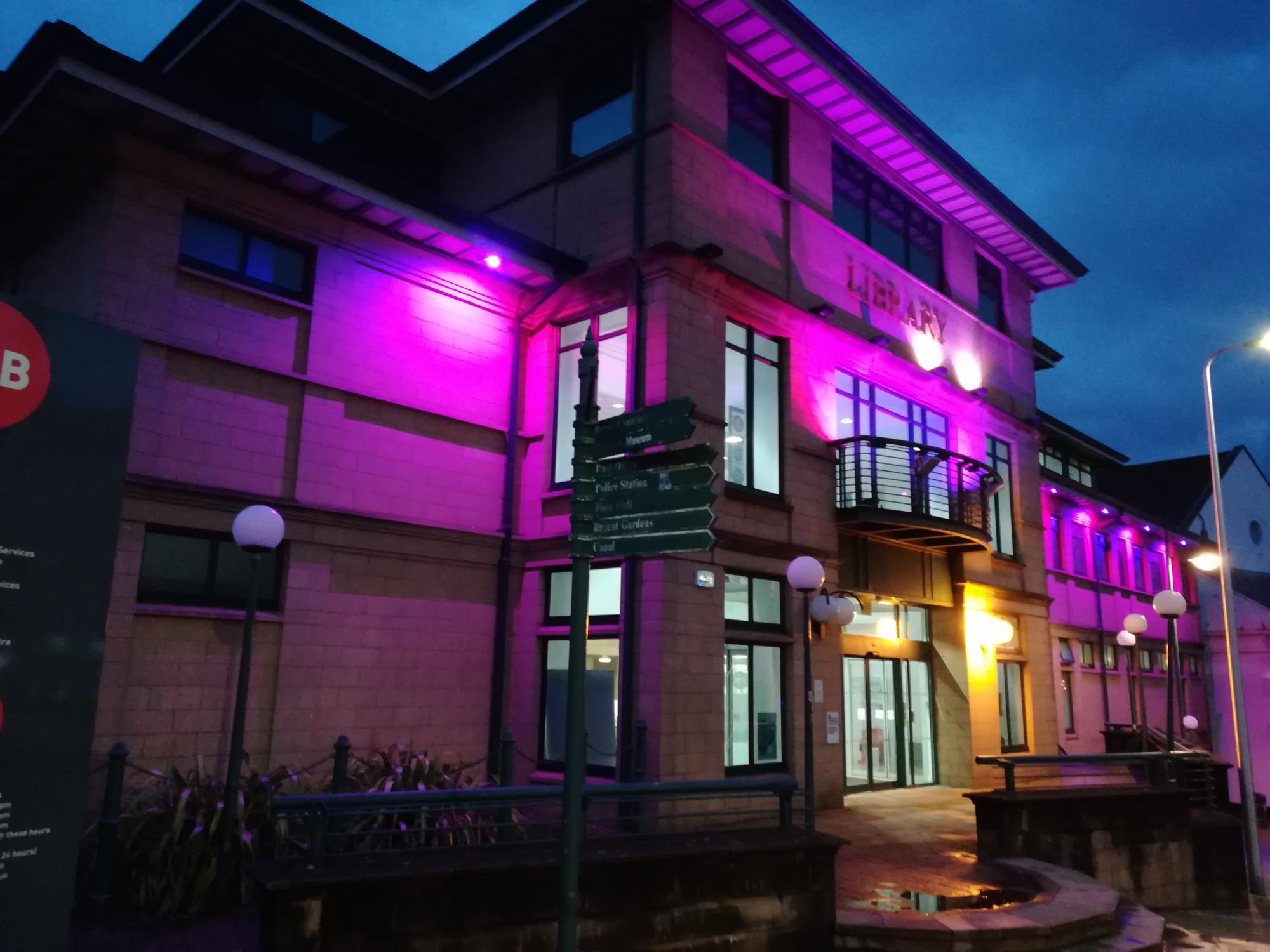 William Patrick Library lit up purple