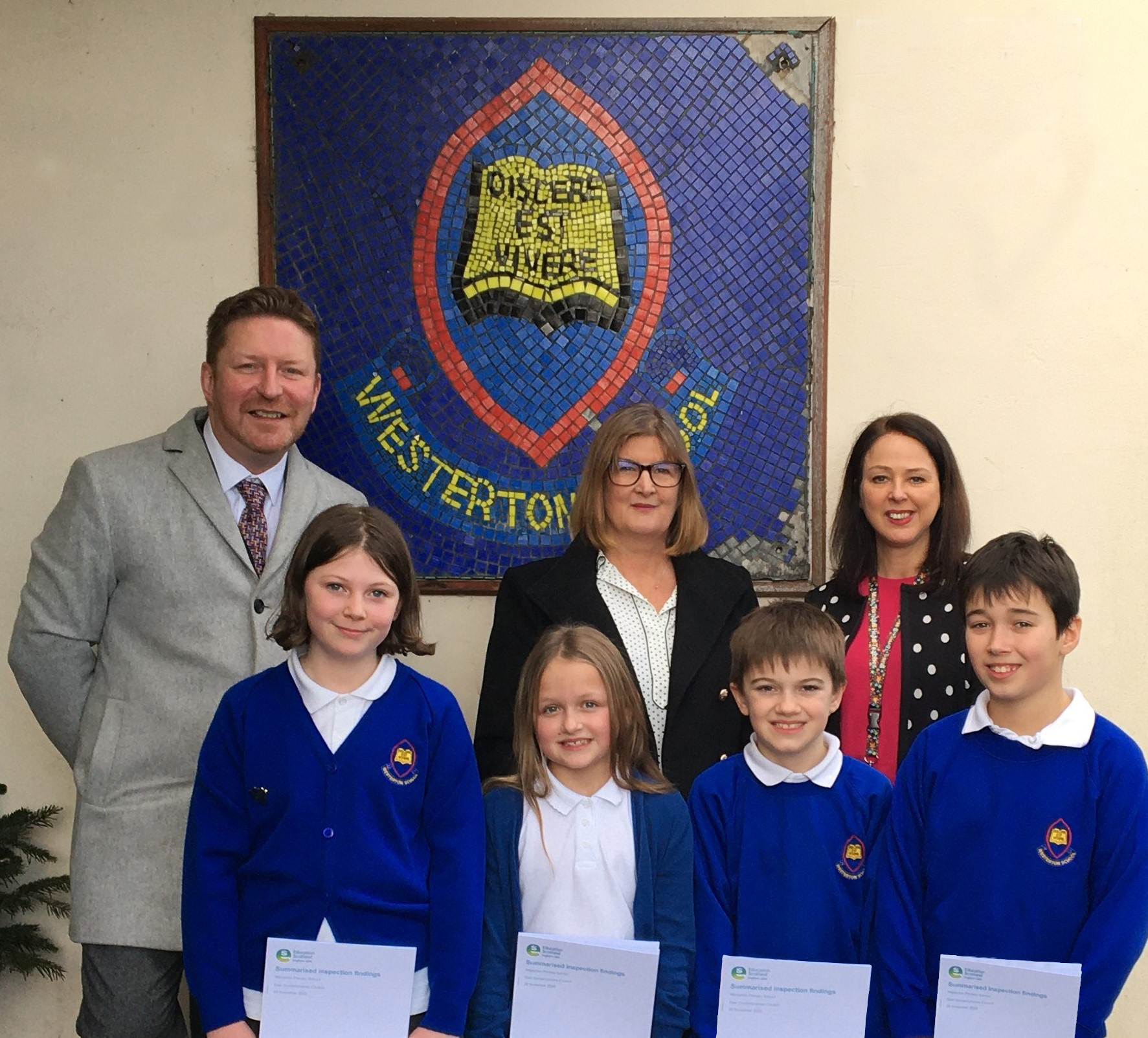 westerton pupils with councillor, inspector and teacher following positive inspection report