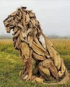 lion sculpture on grass