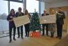 Provost and depute with charity representatives receiving cheque