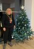 Provost Renwick beside christmas tree