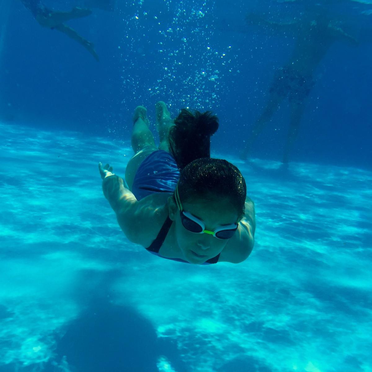 child swimming under water